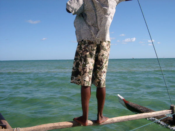 Sailor Balances on Outrigger